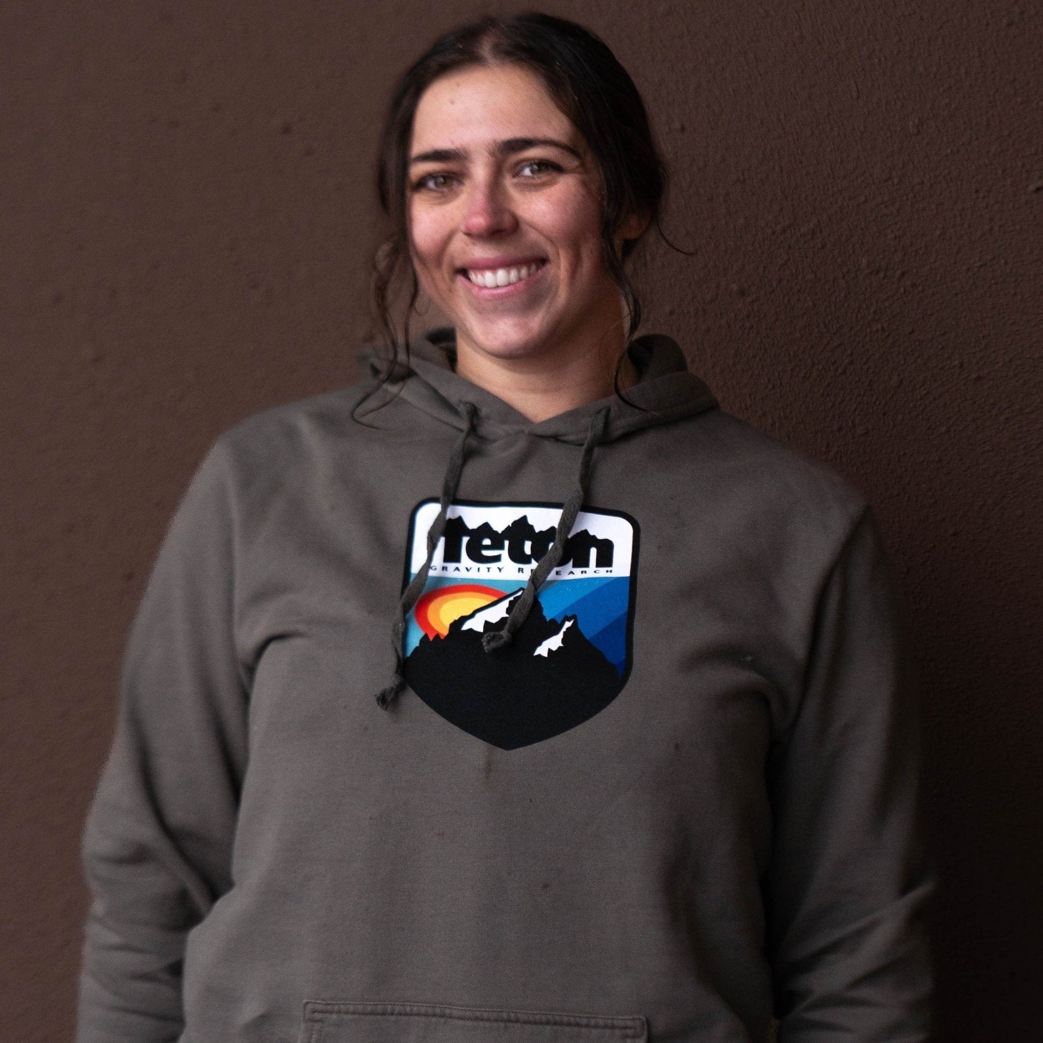 Retro Camp Hoodie 2.0 - Teton Gravity Research. Army green colored sweatshirt with Teton Gravity Research logo with mountains and colorful sunset.